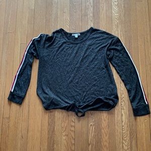 grey long sleeve top with colored stripe on sleeve